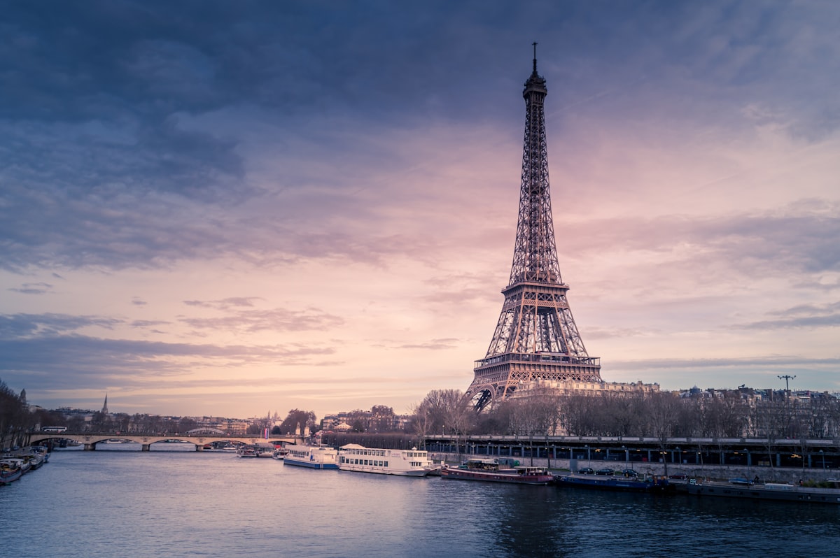 Eiffel Tower rising above Paris rooftops